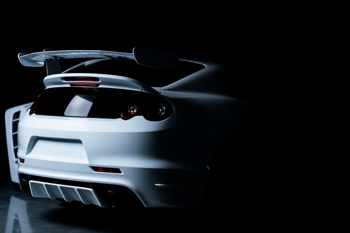 White sports car with dark tinted rear glass